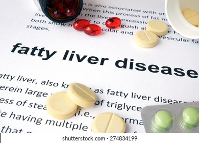 Paper With Fatty Liver Disease And Pills. Medical Concept.