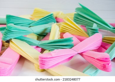 paper flowers for holiday decor. Paper pom-poms - pink, yellow and mint.