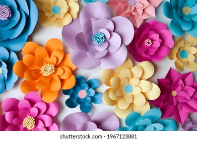 paper flowers. interior decor. wall decoration in the interior. paper decor. flowers in the interior. decoration with large flowers. background for decoration for the holiday.