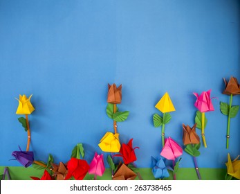paper flowers on blue background.