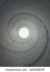 Paper frame with spiral pattern inside kitchen towel.