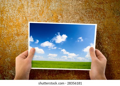 paper in hands and wall