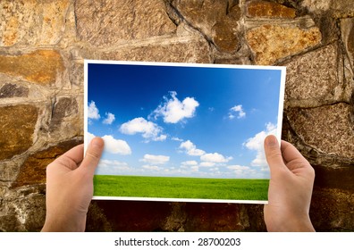 paper in hands and wall