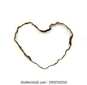 paper with heart shape burnt holes