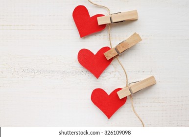 Paper Heart Wall Garland - DIY Valentines Decor Idea, Pinned On Twine, White Wooden Background