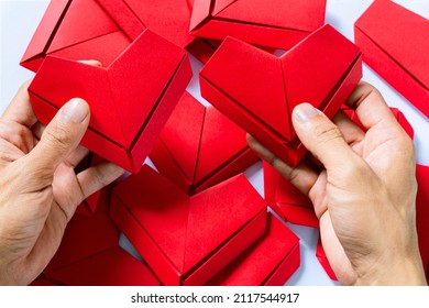 Paper Heart,Hands Holding Folded Origami Heart White Background,Little Boy's Hand Holding Red Heart Paper On Blue Background