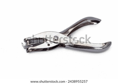 Paper hole puncher isolated on white background