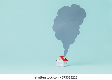 Paper House And Chimney Smoke.