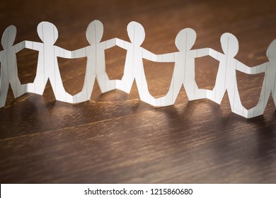 Paper Human Chain On Wood Table