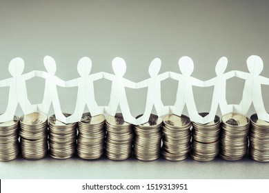 Paper Human Chain Or Teamwork Symbol Stand On The Money Heaps, Team And Budget, Business Startup Or Teamwork For Success Concept