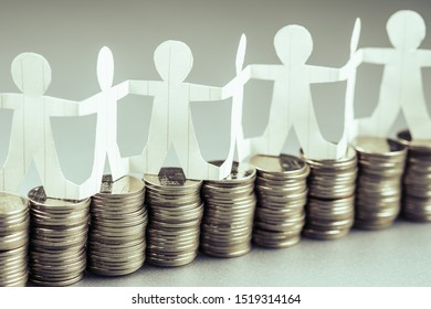 Paper Human Chain Or Teamwork Symbol Stand On The Money Heaps, Team And Budget, Business Startup Or Teamwork For Success Concept