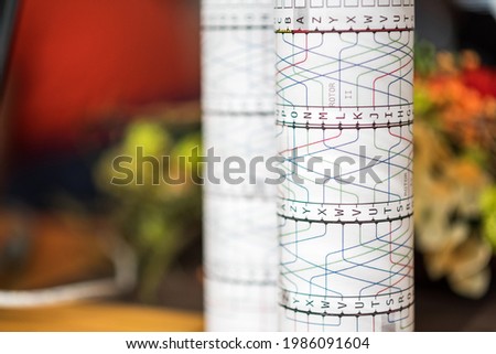 Paper imitation of a cylinder from an encryption, coding, secret enigma machine. Used for teaching or playing for children, students or logical training or cryptography studies at a university.