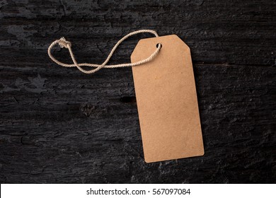 Paper Label On Black Wooden Background