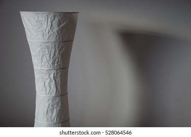 paper lamp and its shadows on white wall - Shutterstock ID 528064546