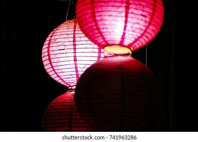 paper lanterns in the dark
