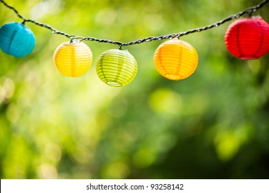 Paper lanterns strung up outside - Powered by Shutterstock