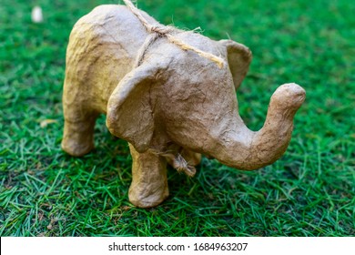 Paper Mache elephant on grass background