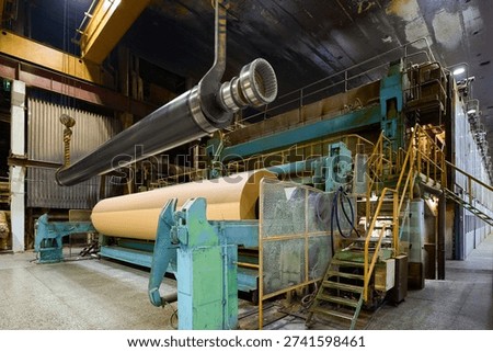 Paper machine operating in a large paper mill during daytime hours