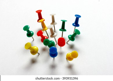 Paper and many color thumbtacks (red, blue, green, yellow, white).  - Shutterstock ID 393931396