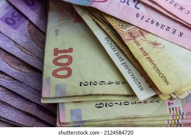 Paper money different denominations, Ukrainian hryvnia in denominations 50,100, 200 hryvnias, new money, background with scattered banknotes. - Shutterstock ID 2124584720