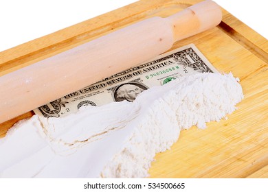 Paper Money Dollars And Wheat Flour On A Wooden Board With A Rolling Pin