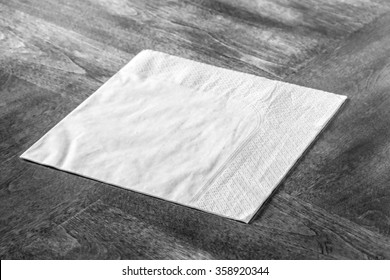 Paper Napkin On Wooden Table