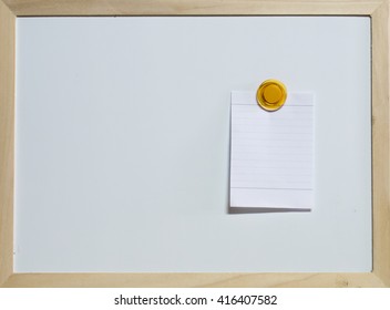 paper note with magnet on whiteboard. Blank paper and a blank area for text input