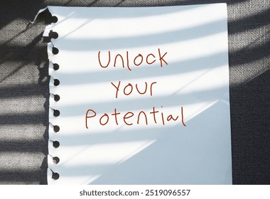 Paper note on gray background with text written Unlock Your Potential - to discover mindset shifts and actions that can transform to better life
