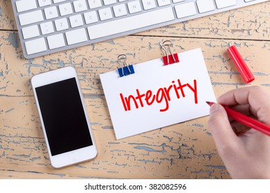 Paper note with text Integrity