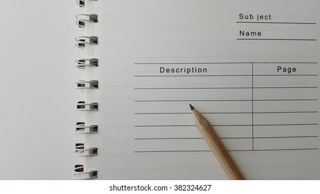 Paper With Pencil With Wording Of Subject Name And Grid Line