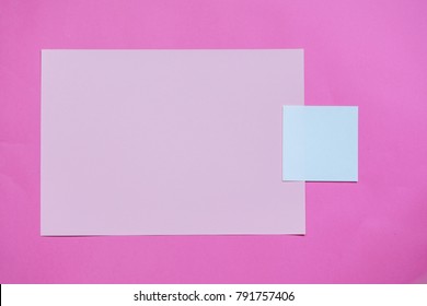 Paper pink background with empty notes. The concept of Valentine Day or bloggers. Flat Lay, top view