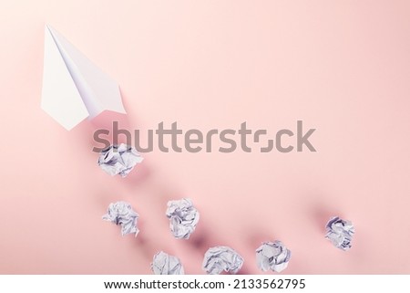 Paper plane letter document message. Top view mock up design of airplane travel, education or innovation origami plane, isolated on pink background with blank empty space for copy space
