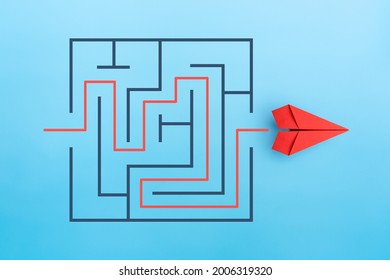Paper plane with maze, Problem and solution concept - Shutterstock ID 2006319320