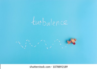 Paper Plane On Blue Background. Turbulence Concept