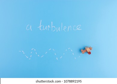 Paper Plane On Blue Background. Turbulence Concept