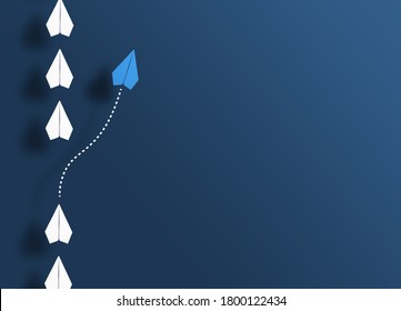 paper planes in a row on blue background and one paper glider going in different direction, breaking new ground and stepping out of the line concept - Shutterstock ID 1800122434