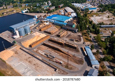 Paper Production Workshops On Big Pulp And Paper Mill, Panoramic View. Wood Pile Wall Outside Factory With Blue Sky At A Industrial Patio