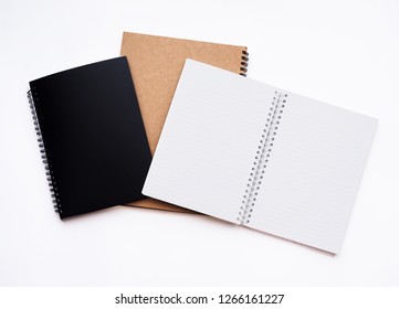 Paper Put On A Black And Brown Book. Object Of Office Or Education In School. There Is Copy Space Available For Recording. Isolated On White Background.