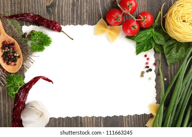 paper for recipes vegetables, and spices on wooden table - Powered by Shutterstock