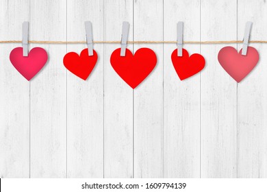 Paper red hearts border on white wood background, copy space. Valentine's Day composition concept. - Shutterstock ID 1609794139