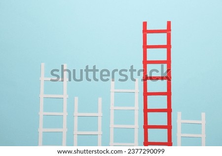 Paper red and white stairs on blue background. Business concept