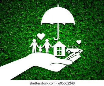 paper salesman agent hand holding family protection on green leaves background. concept accident prevention healthcare insurance.