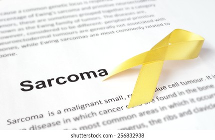 Paper With Sarcoma   And Yellow Ribbon.  