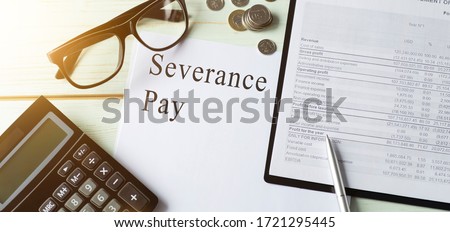 Paper with Severance Pay on a table