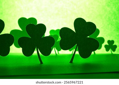 Paper Shamrocks on field of green - Powered by Shutterstock