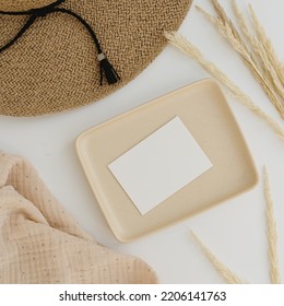 Paper Sheet Card With Blank Mockup Copy Space, Straw Hat And Dried Pampas Grass On White Background