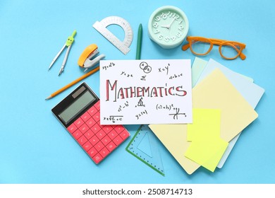 Paper sheet with word MATHEMATICS and school stationery on blue background - Powered by Shutterstock - Get 15% off with code: PIKWIZARD15