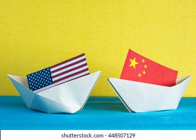 Paper Ship With Flags Of  USA And China. Conflict In South China Sea, Concept Shipment Or Free Trade Agreement And Membership.