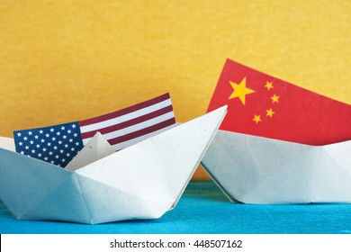 Paper Ship With Flags Of  USA And China. Conflict In South China Sea, Concept Shipment Or Free Trade Agreement And Membership.