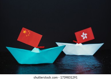 Paper Ship With National Flag Of China And Hong Kong, Concept Of Conflict, Shipment Or Free Trade Agreement 